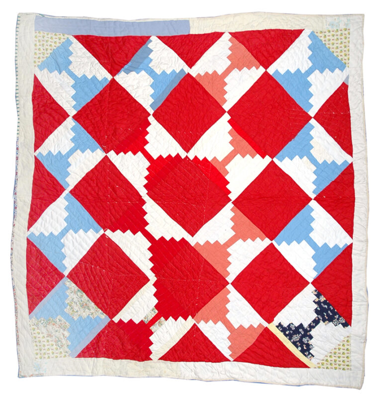 Quilt with red, white, and blue squares.
